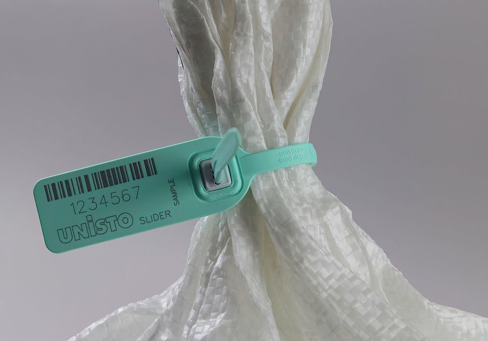 Unisto Slider high-security pull-tight security seal applied to a bag